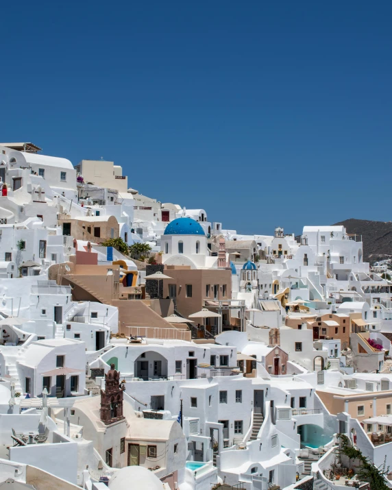 a group of white buildings sitting on top of a hill, pexels contest winner, neoclassicism, lgbtq, greek fabric, thumbnail, multiple stories