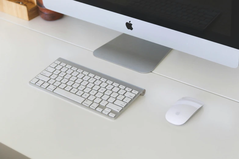 a computer monitor sitting on top of a white desk, by Carey Morris, unsplash, white and silver, computer mouse, ignant, mechanical keyboard