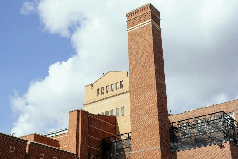 a tall brick building with a clock on top of it, by Rachel Whiteread, unsplash, chemical plant, archive photo, exterior view, tosa school