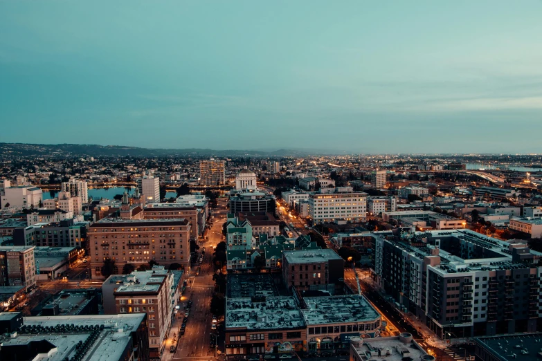 an aerial view of a city at night, a colorized photo, by Matt Cavotta, unsplash contest winner, golden hour scene, central california, background image, portland oregon