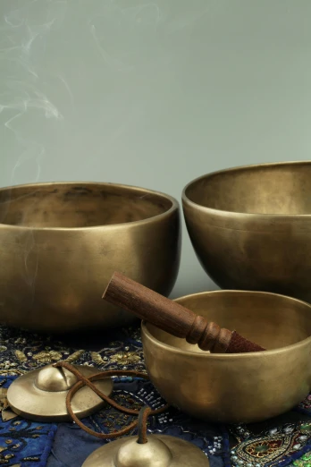 a group of singing bowls sitting on top of a table, an album cover, paul barson, mint, medium detail, 4 2 0