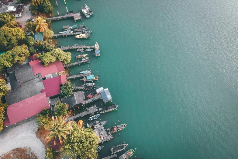 a group of boats sitting on top of a body of water, pexels contest winner, hurufiyya, flatlay, malaysian, teal aesthetic, near a jetty