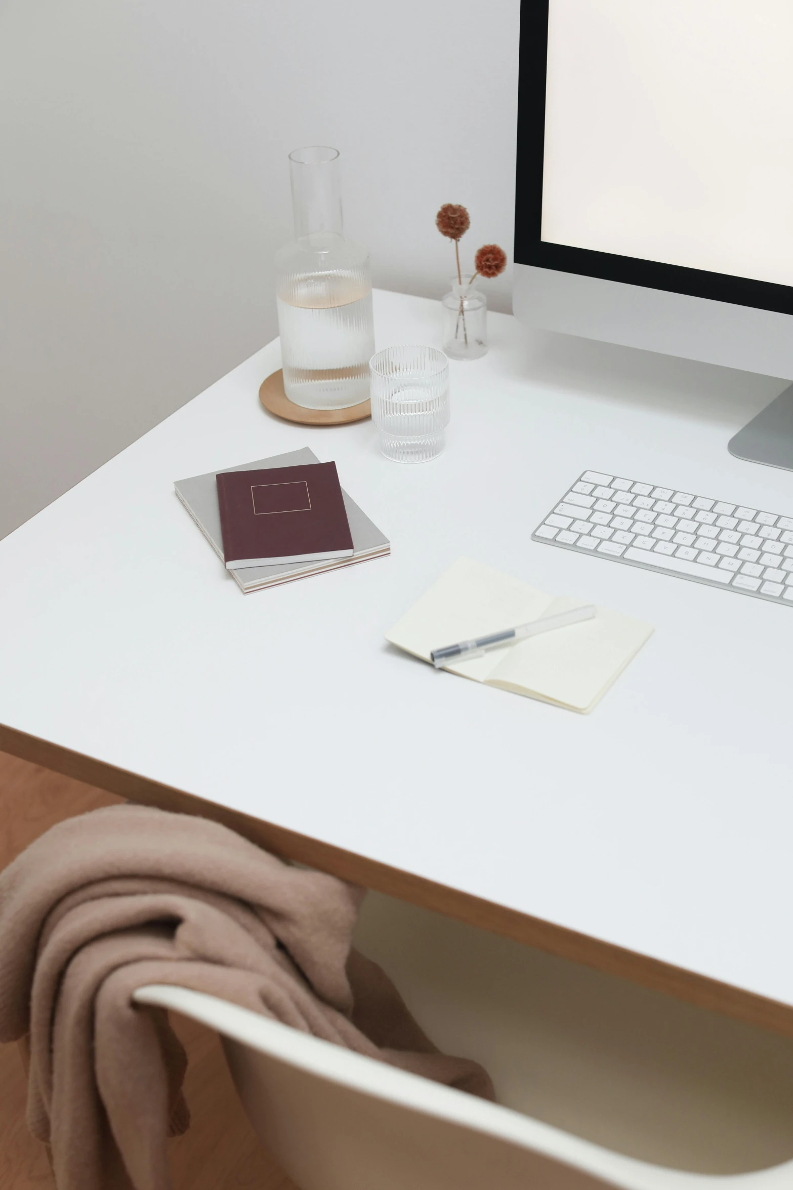 a computer monitor sitting on top of a white desk, private press, cream and white color scheme, holding notebook, maroon and white, dwell