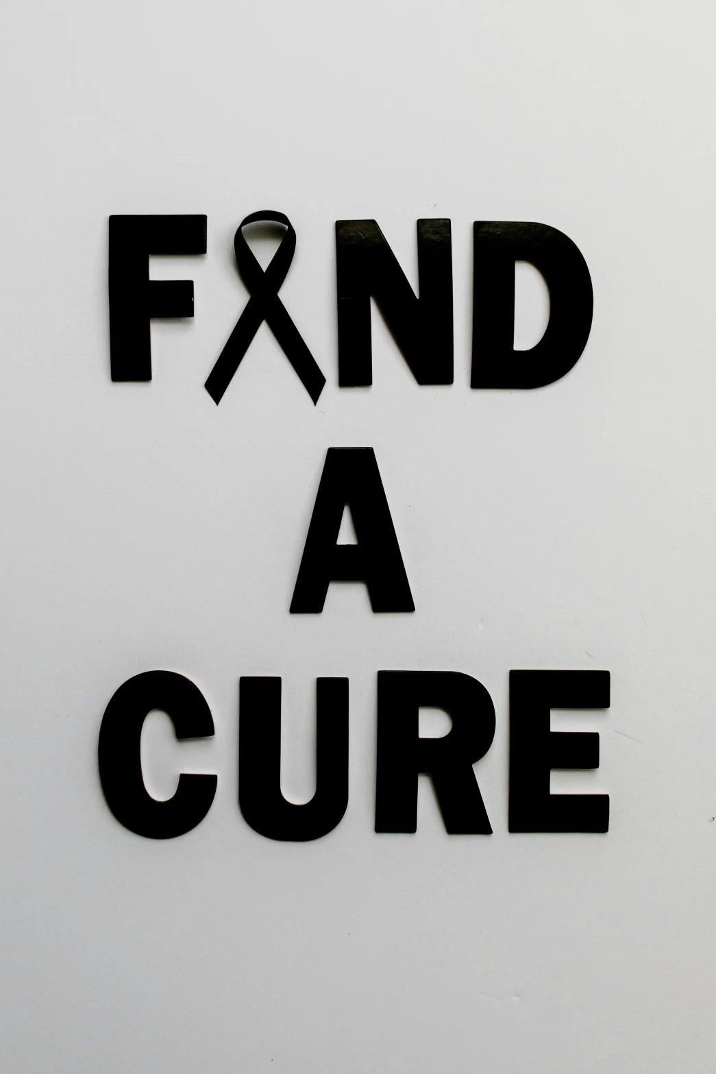 a black and white sign that says find a cure, flickr, 240p, file photo, 1 6 x 1 6, ribbon
