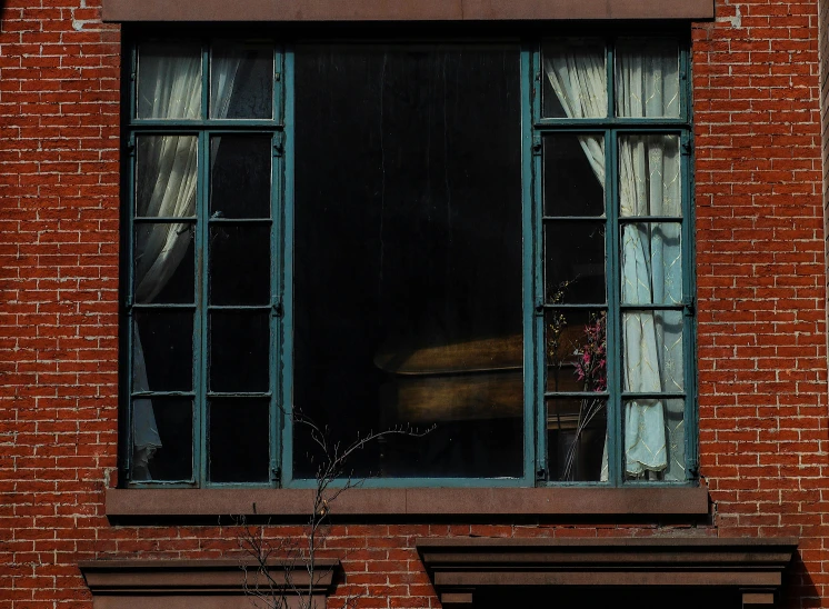 a fire hydrant in front of a brick building, a photo, inspired by Elsa Bleda, large window, ignant, apartment with black walls, andrew newell wyeth