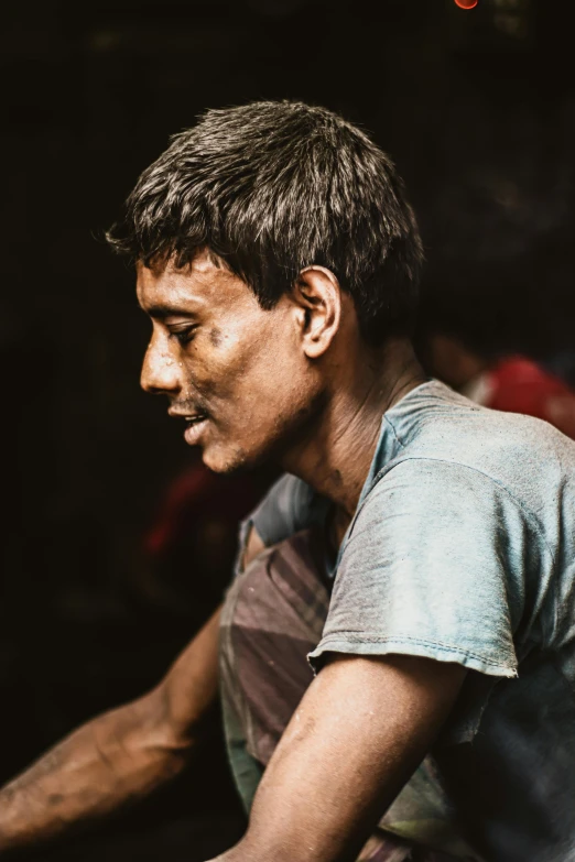 a man holding a tennis racquet on top of a tennis court, a colorized photo, inspired by Steve McCurry, pexels contest winner, single bangla farmer fighting, mining, chiaroscuro portrait, people at work