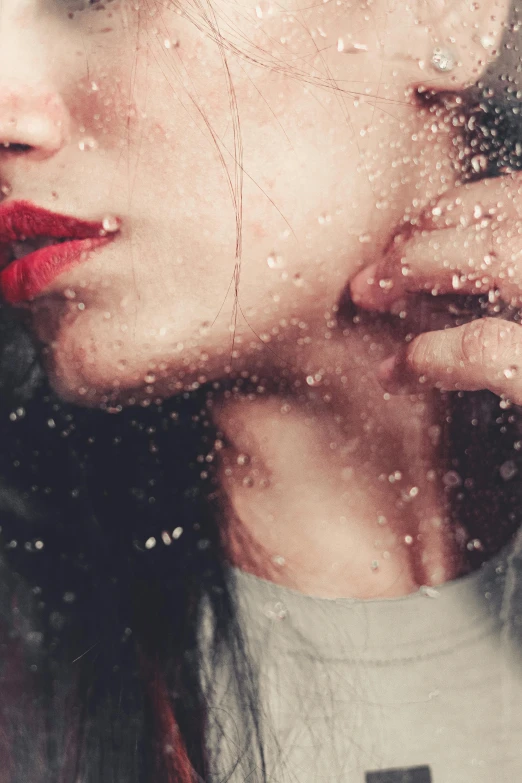 a woman holding a cell phone to her ear, a picture, inspired by Elsa Bleda, trending on pexels, renaissance, made out of rain, faint red lips, snowing, (beautiful) girl