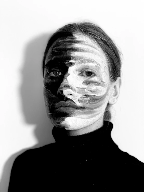 a woman with white paint on her face, a black and white photo, inspired by Anna Füssli, striped, 1997 ), wearable art, ewa juszkiewicz