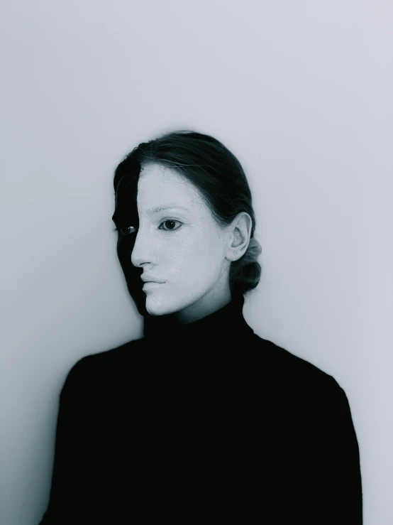 a black and white photo of a woman with white paint on her face, a black and white photo, inspired by Anna Füssli, half and half, symmetrical face and full body, an ai generated image, taken in the 2000s