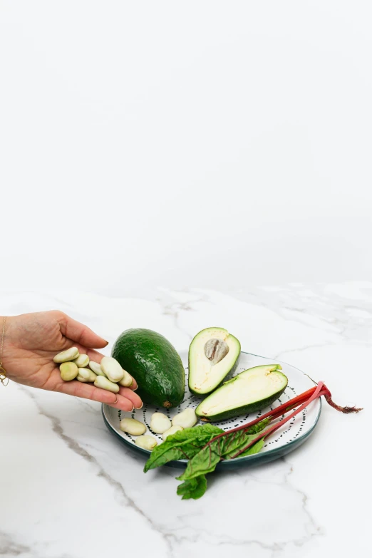a person reaching for an avocado on a plate, by Matthias Stom, ingredients on the table, detailed product image
