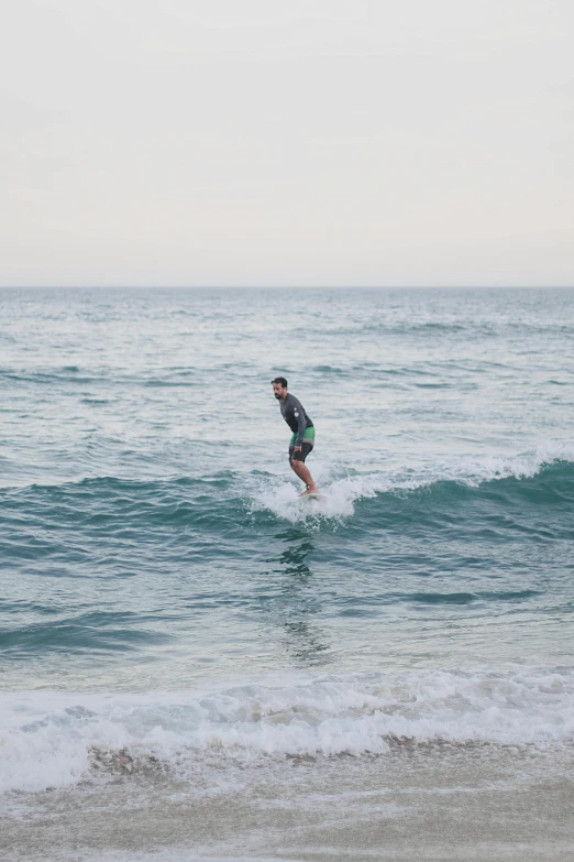 a man riding a wave on top of a surfboard, 6 : 3 0 am, melbourne, slightly minimal, concerned