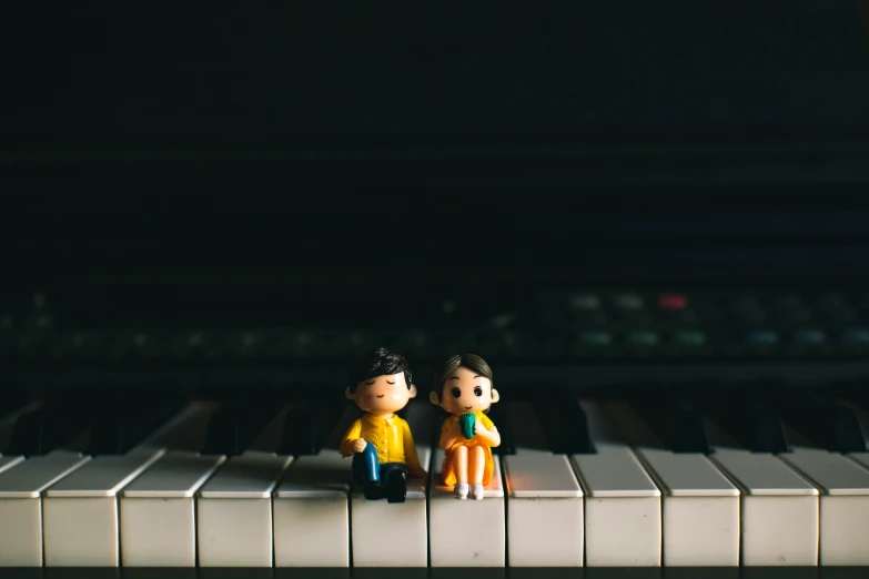 a couple of figurines sitting on top of a piano, unsplash, toy photo, instagram photo, nendoroid, portrait photo