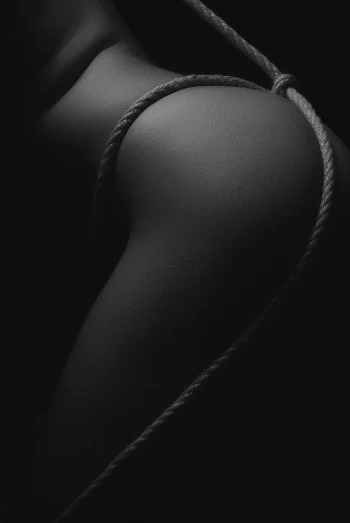 a black and white photo of a woman tied to a rope, inspired by Robert Mapplethorpe, shaped derriere, skin detail, couple, cgsociety 4k”