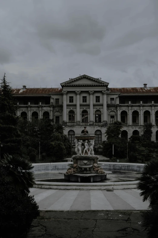 a large building with a fountain in front of it, a statue, unsplash contest winner, quito school, abandoned hospital, background image, dark and gloomy, on a great neoclassical square