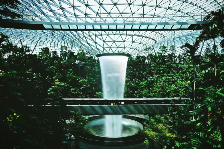the inside of a building with a waterfall coming out of it, inspired by Cheng Jiasui, pexels contest winner, environmental art, lush garden spaceship, norman foster, airport, avatar image