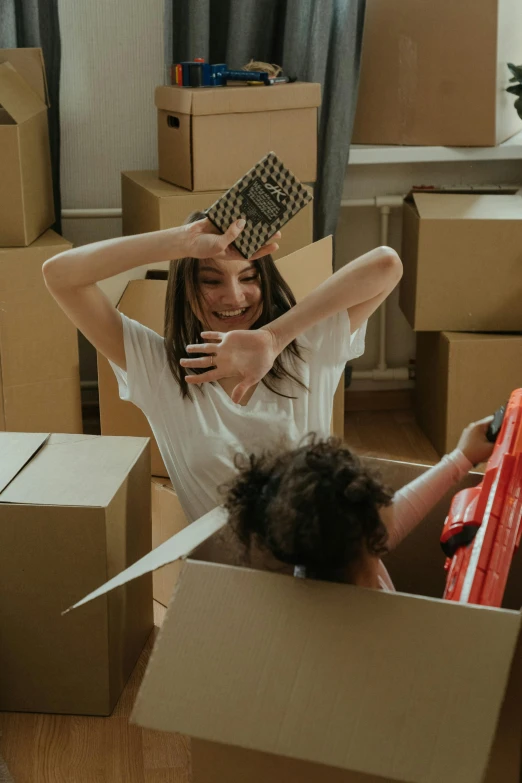 a woman and a child in a cardboard box, pexels contest winner, happening, bulky build, avatar image, top down photo, inspect in inventory image