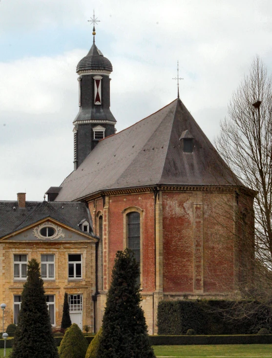 a large brick building with a clock tower, by Villard de Honnecourt, pexels, romanesque, panorama, the narthex, van lieven, february)