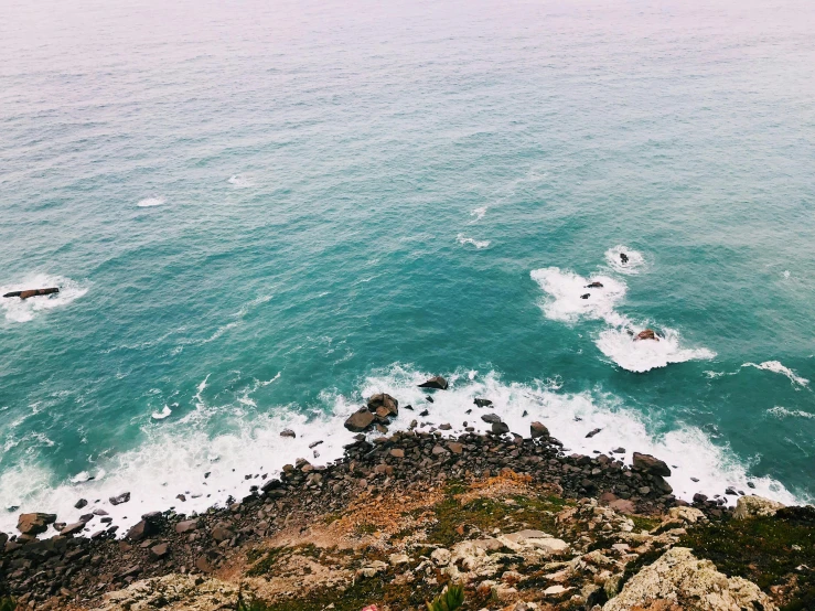 a view of the ocean from the top of a hill, pexels contest winner, cresting waves and seafoam, rocky cliffs, instagram post, flat lay