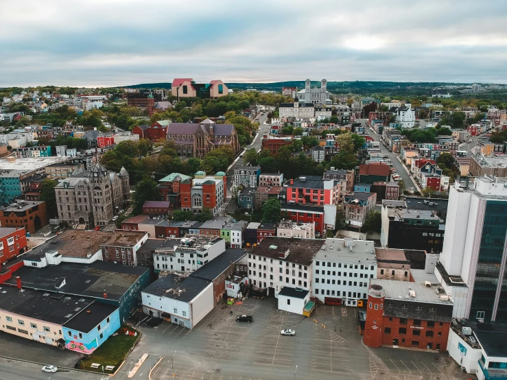 an aerial view of a city with lots of buildings, pexels contest winner, plein air, quebec, paisley, high quality photo, square