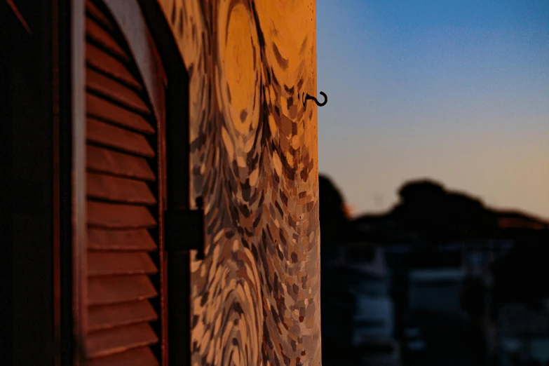 a close up of a wooden pole with graffiti on it, pexels contest winner, art photography, refracted sunset, swirled architecture, neighborhood outside window, taken with canon 5d mk4