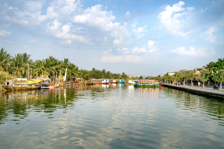 a body of water filled with lots of boats, pexels contest winner, ao dai, backwater bayou, thumbnail, sunny sky