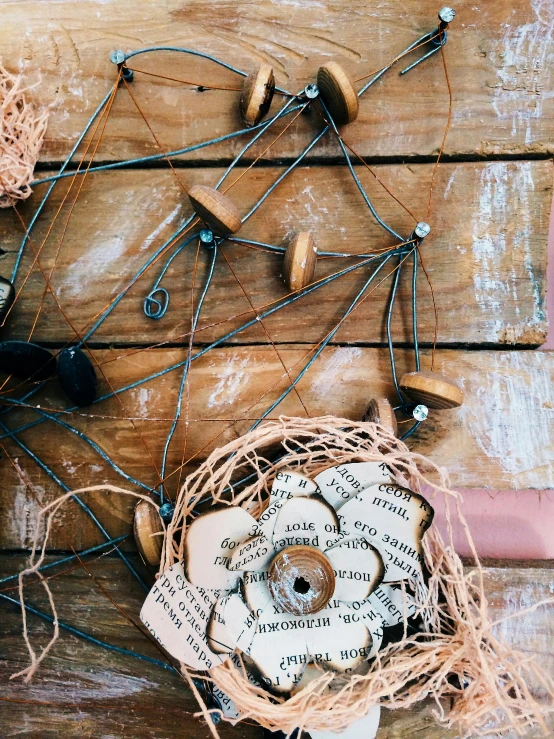 a couple of birds sitting on top of a wooden table, pexels contest winner, kinetic art, wrapped in flowers and wired, modern rustic”, wood ornaments, - 9