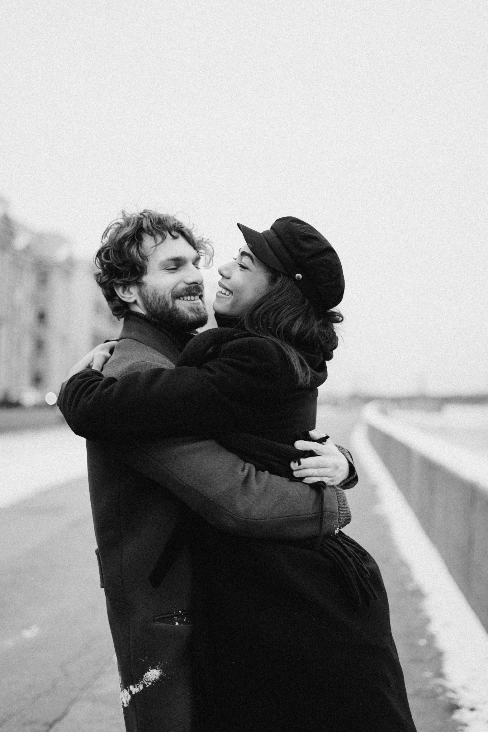 a black and white photo of a man hugging a woman, a black and white photo, pexels contest winner, excited russians, promo image, january and february, shore