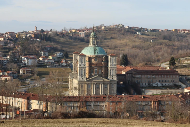 a large building sitting on top of a lush green hillside, inspired by Jacopo de' Barbari, renaissance, cathedral in the background, terracotta, snowy apennines, gigapixel