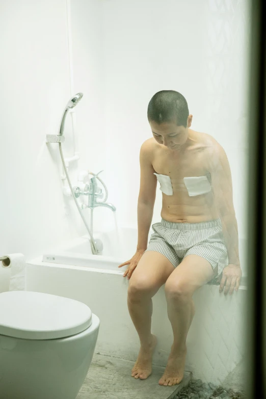 a man sitting on a toilet in a bathroom, inspired by Zhang Kechun, unsplash, shin hanga, translucent body, injured, けもの, preparing to fight