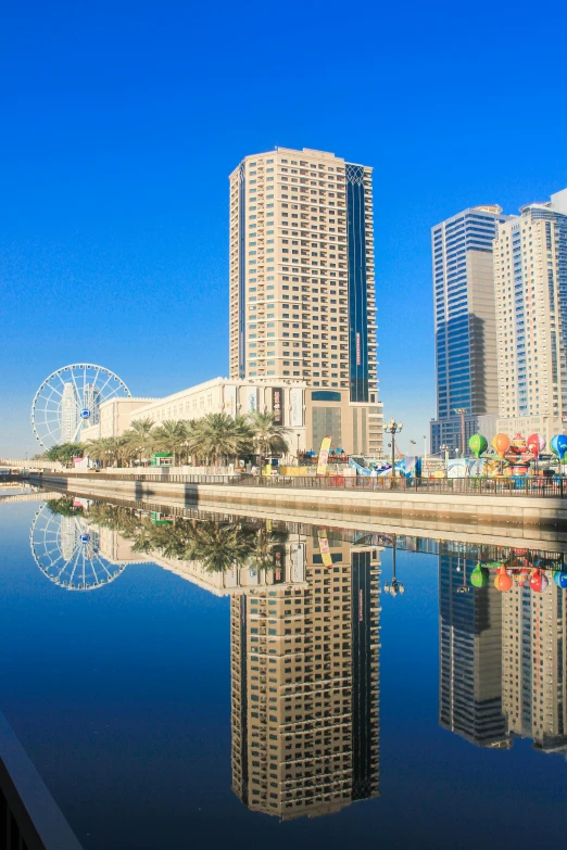 a large body of water surrounded by tall buildings, hurufiyya, full of clear glass facades, near the beach, reflecting, skybridge towers