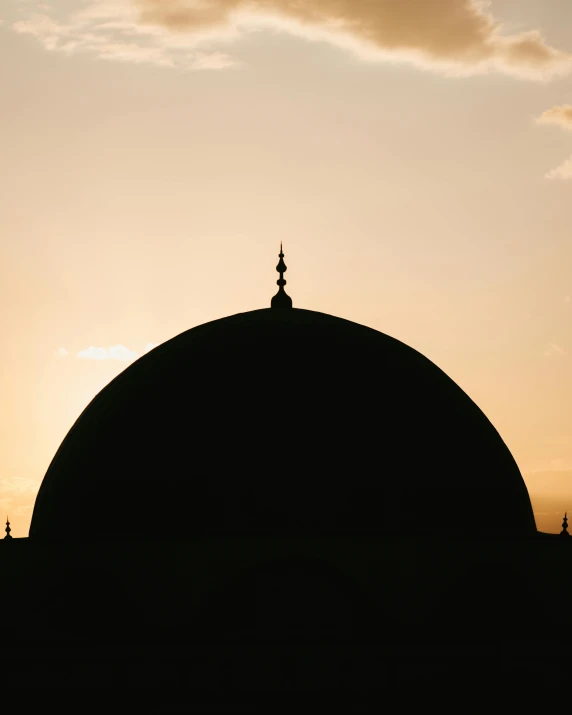 a silhouette of a dome with a cross on top, inspired by Osman Hamdi Bey, trending on unsplash, hurufiyya, slightly tanned, indonesia, 2 0 0 0's photo, instagram photo