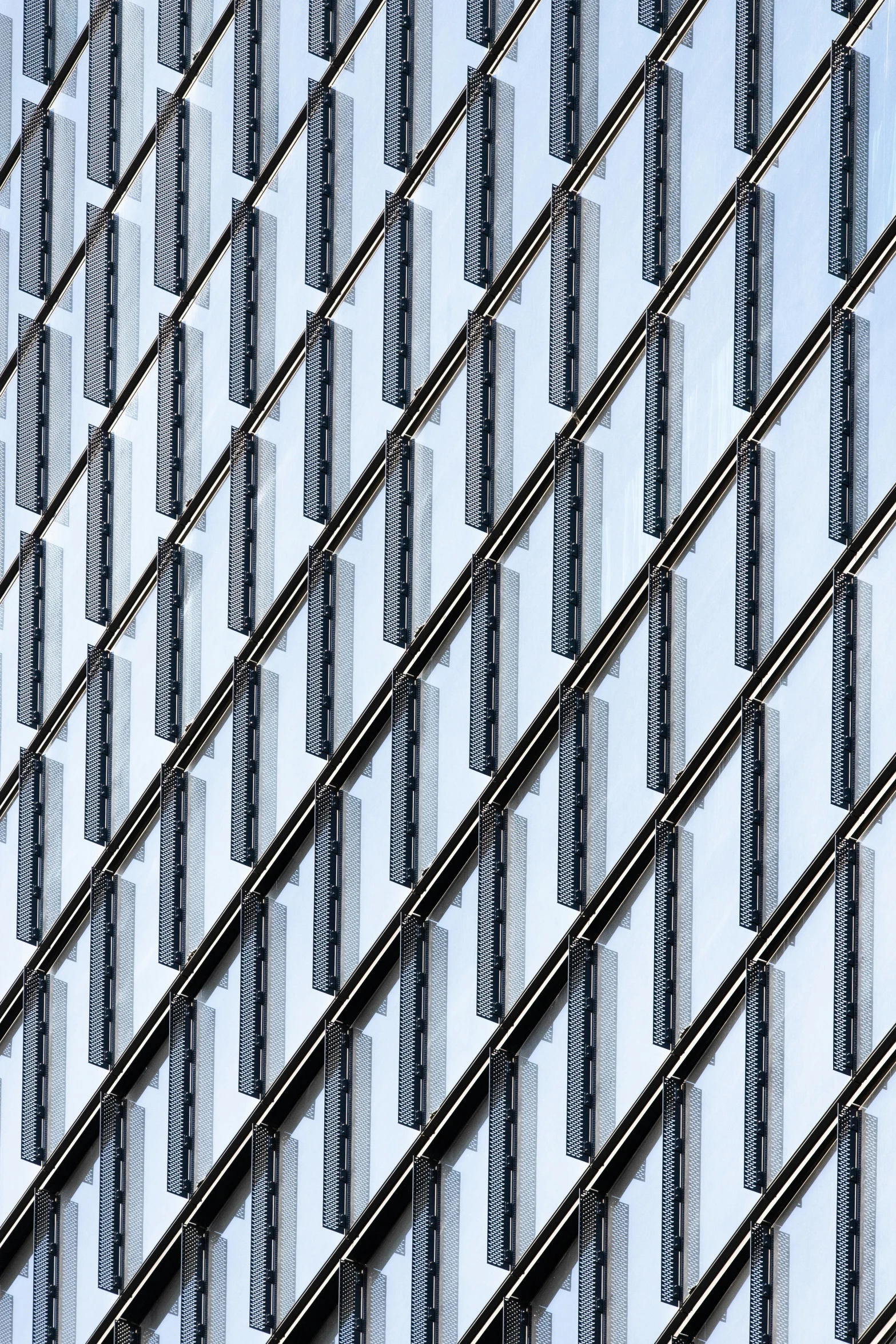 a clock mounted to the side of a building, inspired by Andreas Gursky, unsplash, op art, metal bars, lots of glass details, rows of razor sharp teeth, lattice