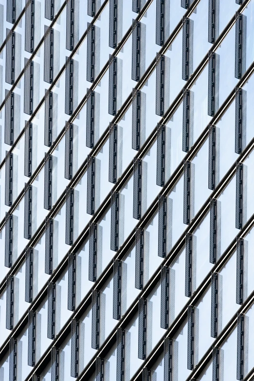 a clock mounted to the side of a building, inspired by Andreas Gursky, unsplash, op art, metal bars, lots of glass details, rows of razor sharp teeth, lattice