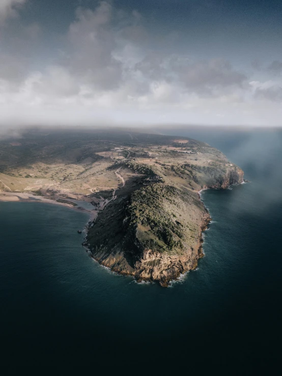 an island in the middle of the ocean, pexels contest winner, high detailed photography cape, arma 3, in a vast serene landscape, long cinematic shot