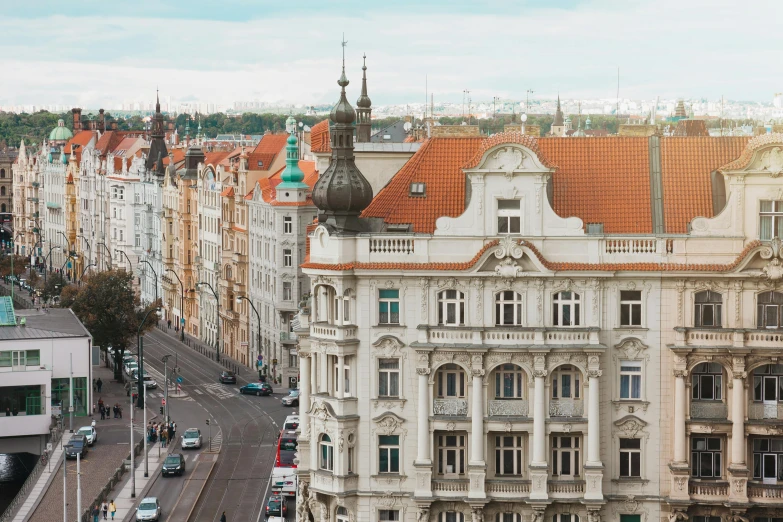 a city street filled with lots of tall buildings, a photo, by Adam Marczyński, pexels contest winner, art nouveau, white buildings with red roofs, rococo and baroque styles, square, brown