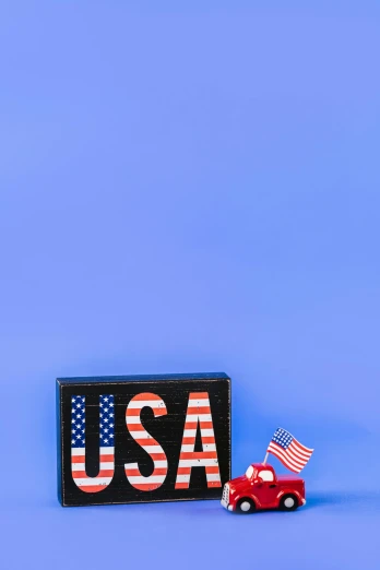 a red truck and an american flag on a blue background, unsplash, american scene painting, wooden art toys on base, snapchat photo, colorful signs, ultra hi resolution picture