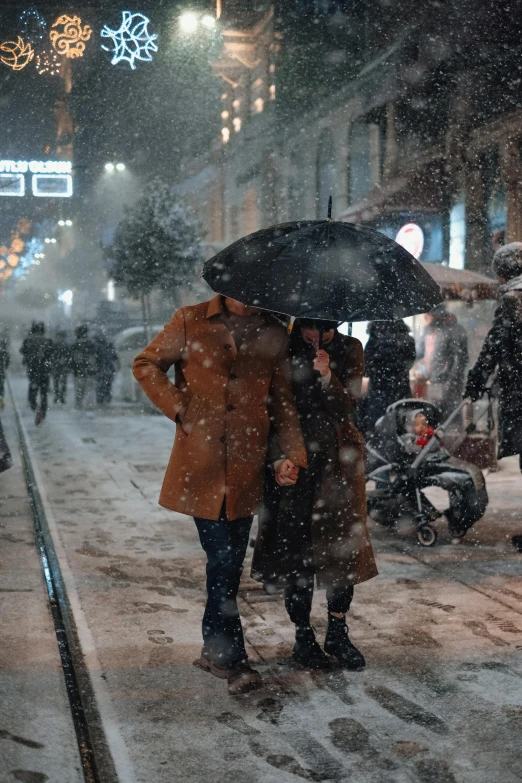 a couple of people that are standing in the snow, by irakli nadar, pexels contest winner, hyperrealism, busy streets, turkey, movie still from bladerunner, holiday season