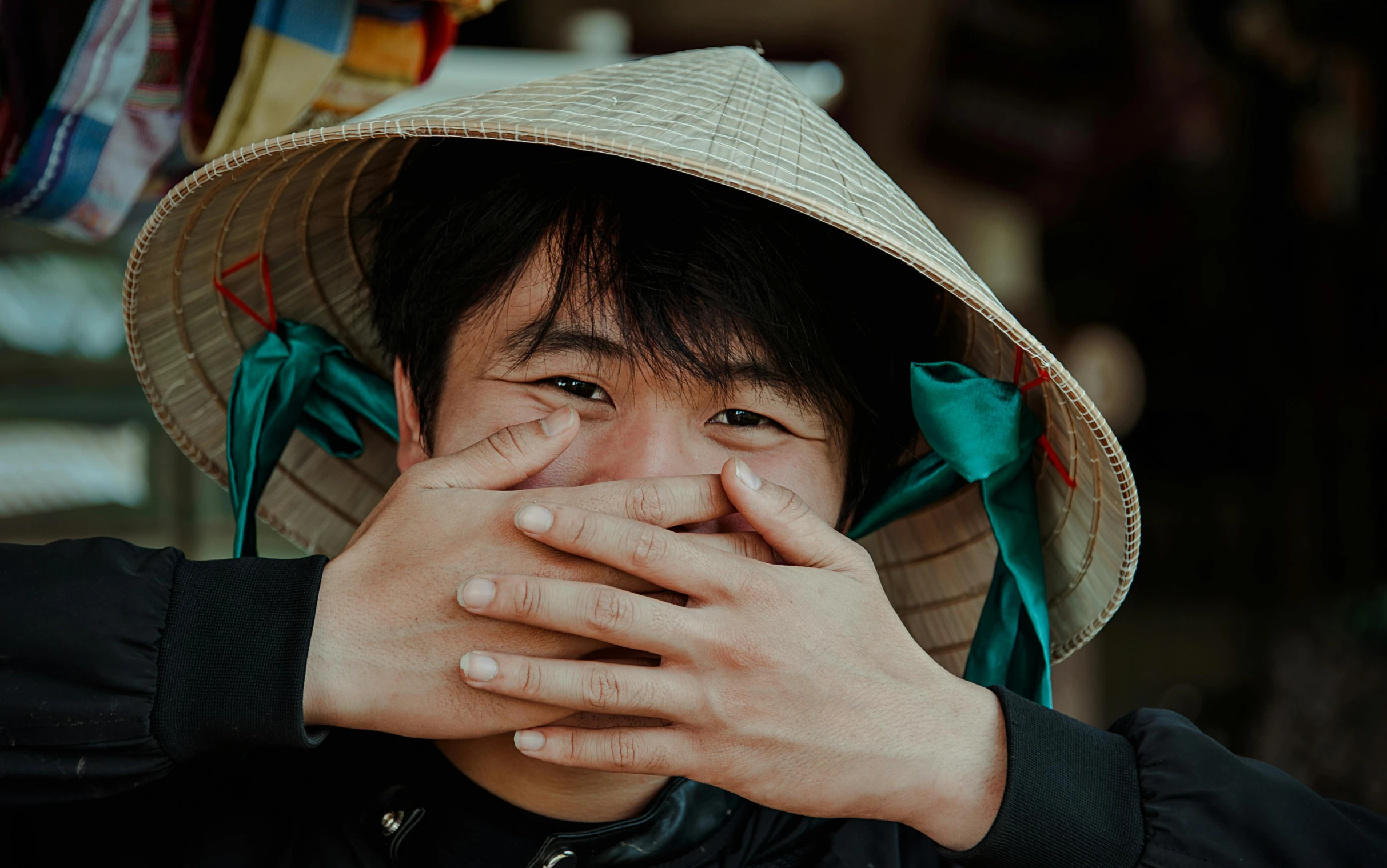 a close up of a person with a hat on, pexels contest winner, happening, asian face, hand on his cheek, playful peasant man, avatar image