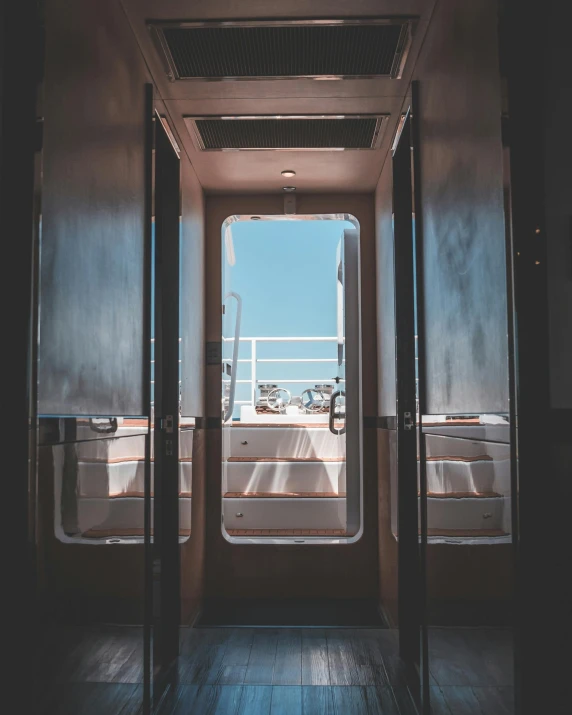 an open door leading to a balcony with a view of the ocean, trending on unsplash, light and space, inside an underwater train, thumbnail, lgbtq, shaped like a yacht