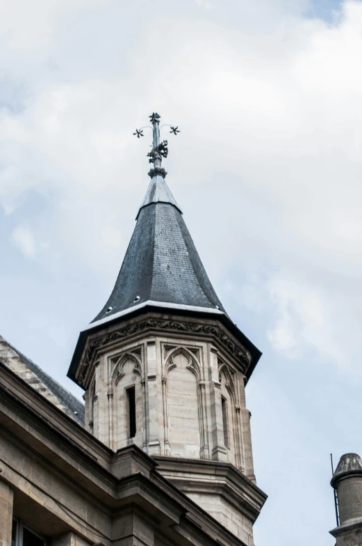 a clock that is on the side of a building, lead - covered spire, épaule devant pose, pointy conical hat, lofty heavens