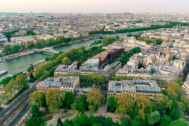 the view of paris from the top of the eiffel tower, a photo, pexels contest winner, paris school, photo of green river, city buildings on top of trees, 2022 photograph, high angle uhd 8 k