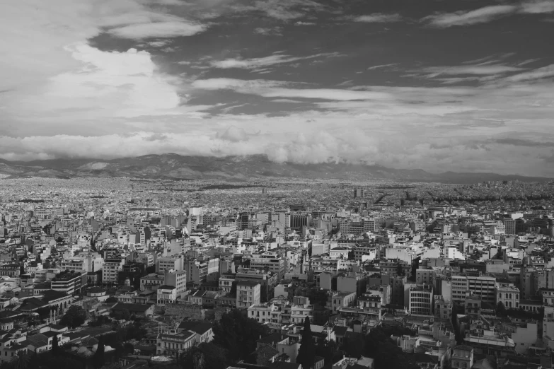 a black and white photo of a city, by Luis Molinari, athens in the background, detailed medium format photo, [ [ hyperrealistic ] ], uploaded