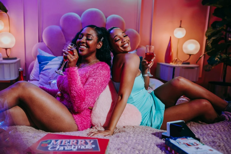 a couple of women sitting on top of a bed, trending on pexels, happening, party at midnight, patron saint of 🛸🌈👩🏾, promo shot, 💋 💄 👠 👗