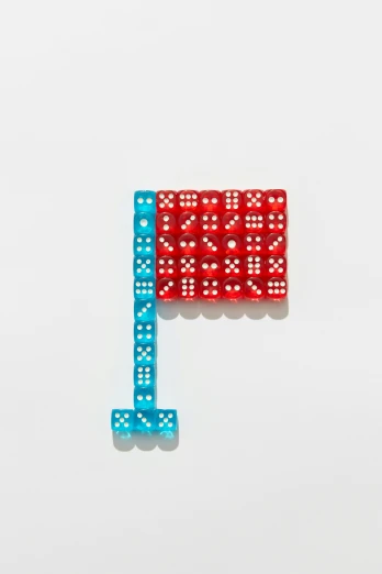 a red and blue piece of dice sitting on top of a white surface, feng zhu |, tetris, flag, binary