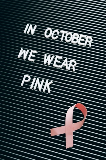 a sign that says in october we wear pink, by Julia Pishtar, happening, 15081959 21121991 01012000 4k, instagram story, billboard image, ribbon