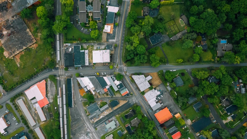 an aerial view of a city with lots of buildings, by Carey Morris, pexels, photorealism, suburbia street, washington, a green, drone photo