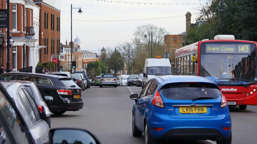 a city street filled with lots of traffic, barnet, thumbnail, square, environmental shot