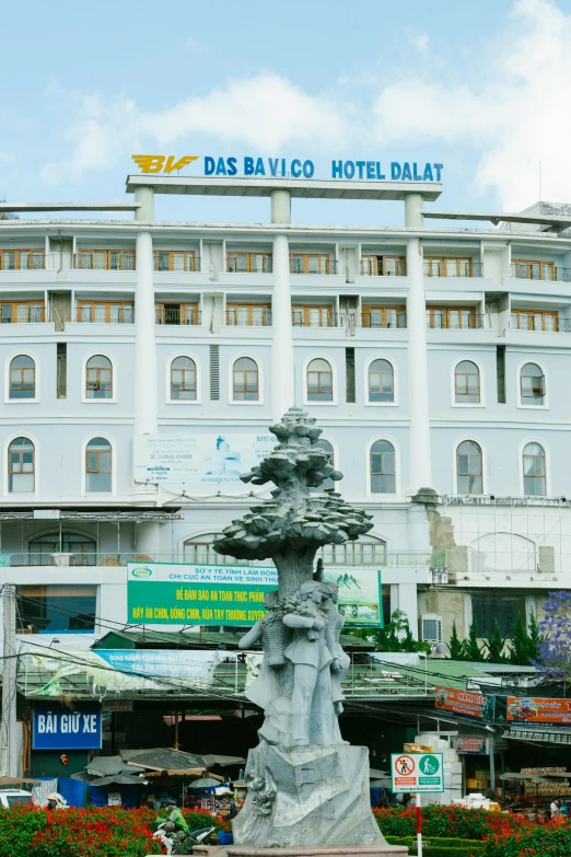 a large white building with a fountain in front of it, an album cover, inspired by Balázs Diószegi, dau-al-set, dang my linh, hotel, overview, front view
