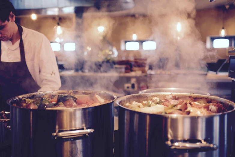 a man preparing food in a restaurant kitchen, pexels, process art, cauldrons, commercial banner, feature, brown