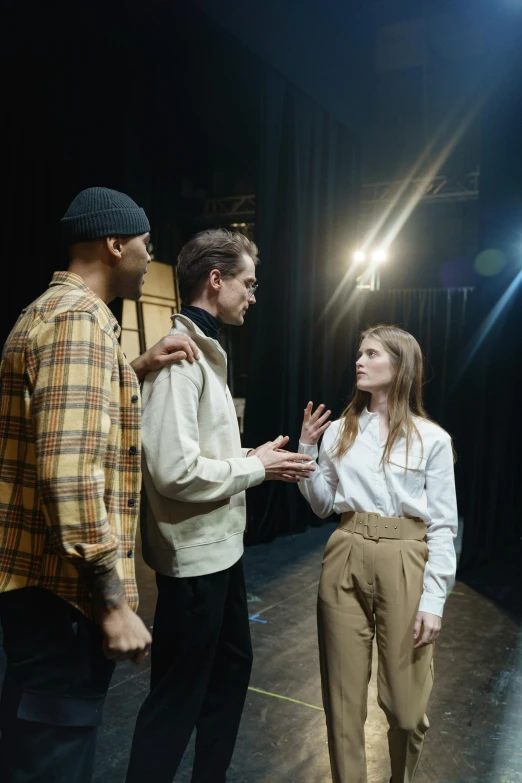 a group of people standing on top of a stage, a portrait, pexels, renaissance, 3 actors on stage, concerned, college, medium shot of two characters